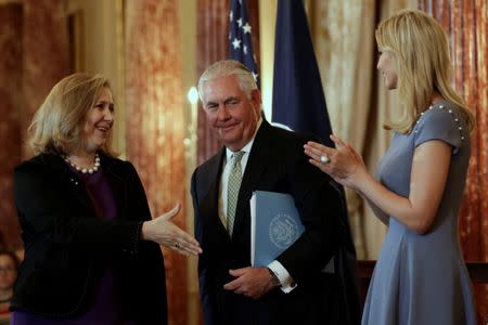 U.S. Secretary of State Rex Tillerson (C) looks as Susan Coppedge (L), Ambassador-at-Large to Monitor and Combat Trafficking in Persons, greets Ivanka Trump at the 2017 Trafficking in Persons Report (TIP) Ceremony at the State Department in Washington, U.S., June 27, 2017. REUTERS/Yuri Gripas