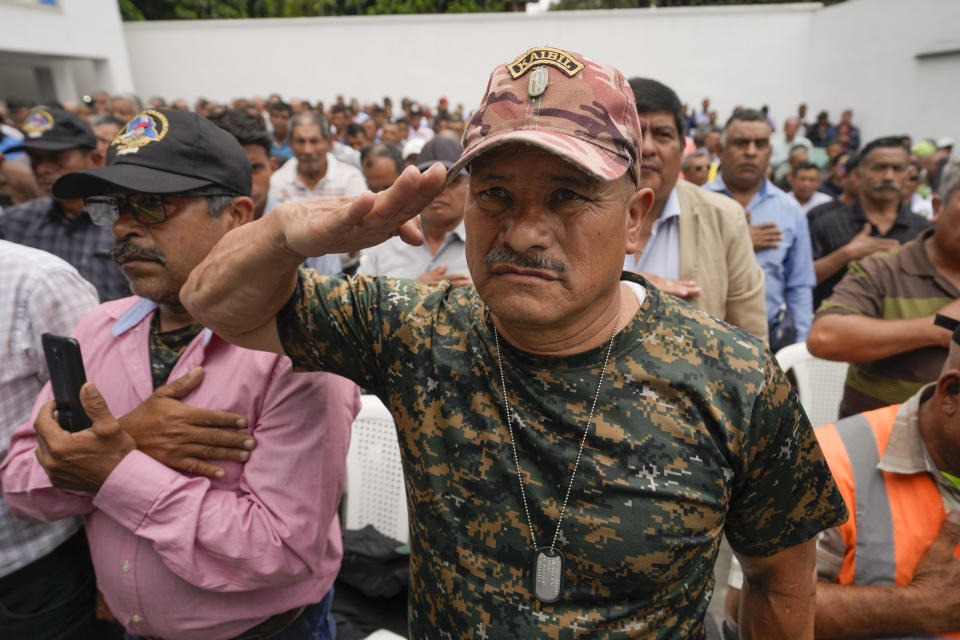Guatemalan Army veterans sing the national anthem during meeting with the UNE party presidential candidate Sandra Torres in Guatemala City, Tuesday, Aug. 15, 2023. Torres will face Bernardo Arévalo of the Seed Movement party in an Aug. 20 runoff election. (AP Photo/Moises Castillo)