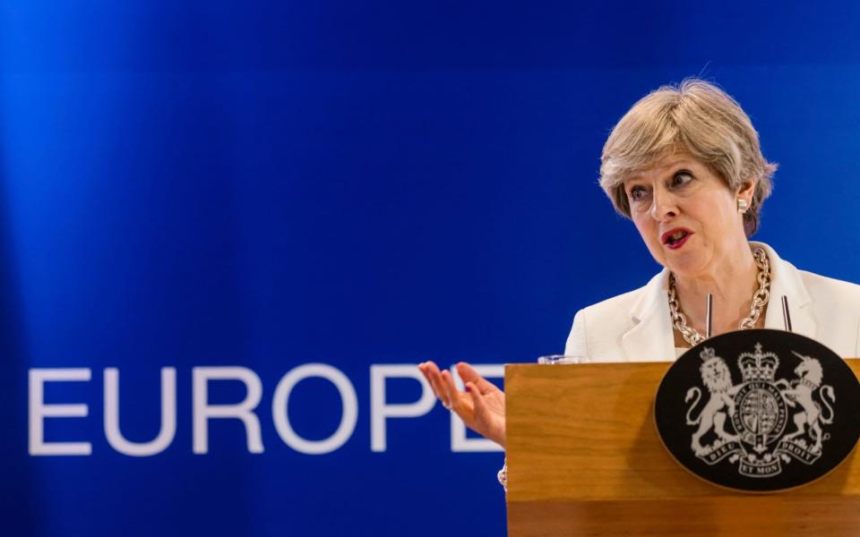 British Prime Minister Theresa May speaks during a media conference at an EU summit in Brussels  - AP