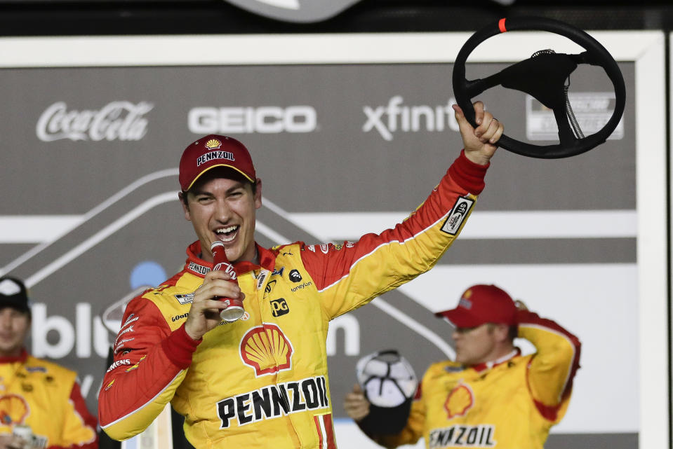 Joey Logano celebrates in Victory Lane after winning the first of the two NASCAR Daytona 500 qualifying auto races at Daytona International Speedway, Thursday, Feb. 13, 2020, in Daytona Beach, Fla. (AP Photo/John Raoux)