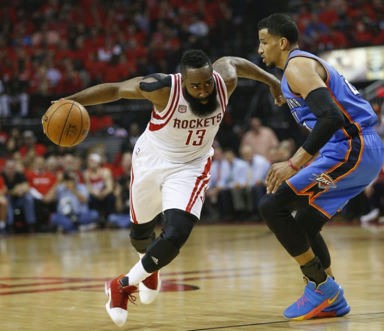 James Harden of the Houston Rockets drives around Andre Roberson of the Oklahoma City Thunder in Game Five of the Western Conference quarter-finals during the 2017 NBA Playoffs, at Toyota Center in Houston, Texas, on April 25