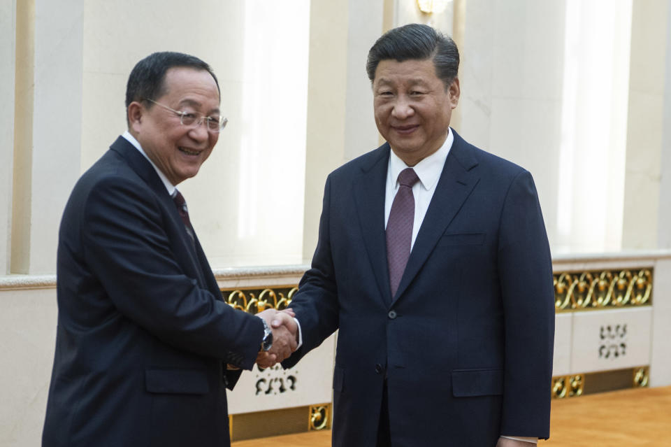 China's President Xi Jinping, right, shakes hands with North Korean Foreign Minister Ri Yong Ho at the Great Hall of the People in Beijing, Friday, Dec. 7, 2018. The foreign ministers of China and North Korea held talks in Beijing Friday amid a lack of progress in international efforts to persuade Kim Jong Un's regime to halt its nuclear weapons program.(Fred Dufour/Pool Photo via AP)