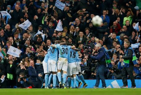 Football Soccer - Manchester City v Paris St Germain - UEFA Champions League Quarter Final Second Leg - Etihad Stadium, Manchester, England - 12/4/16 Kevin De Bruyne celebrates with team mates after scoring the first goal for Manchester City Action Images via Reuters / Jason Cairnduff