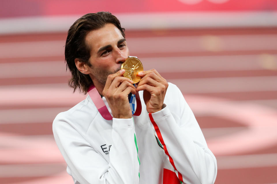 Gianmarco Tamberi of Italy kisses his gold medal