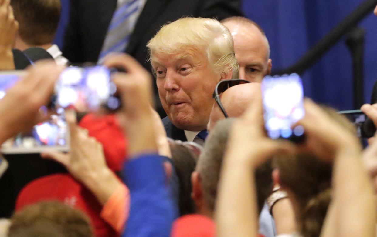 Presidential candidate Donald Trump greets fans after his campaign rally Oct. 17, 2016, at the KI Convention Center in Green Bay.