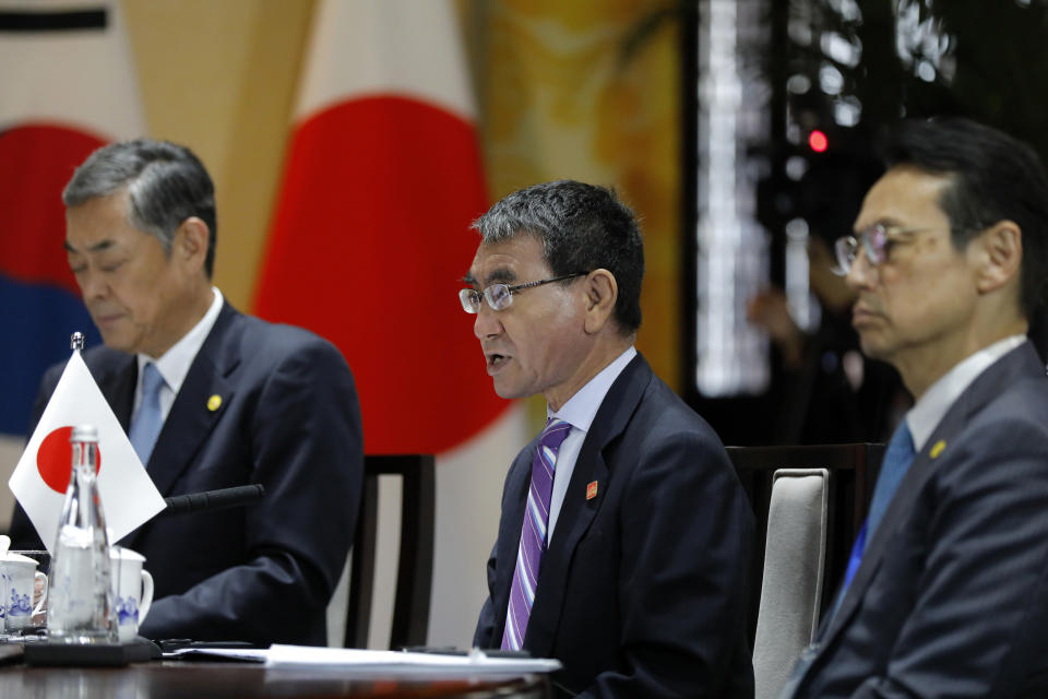 Japanese Foreign Minister Taro Kono, center, speaks with his Chinese counterpart Wang Yi, and South Korean counterpart Kang Kyung-wha during their trilateral meeting at Gubei Town in Beijing Wednesday, Aug. 21, 2019. (Wu Hong/Pool Photo via AP)