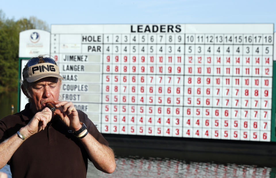 Miguel A. Jimenez kites a cigar after wining the Greater Gwinnett Championship golf tournament of the Champions Tour, Sunday, April 20, 2014 in Duluth, Ga. (AP Photo/John Bazemore)
