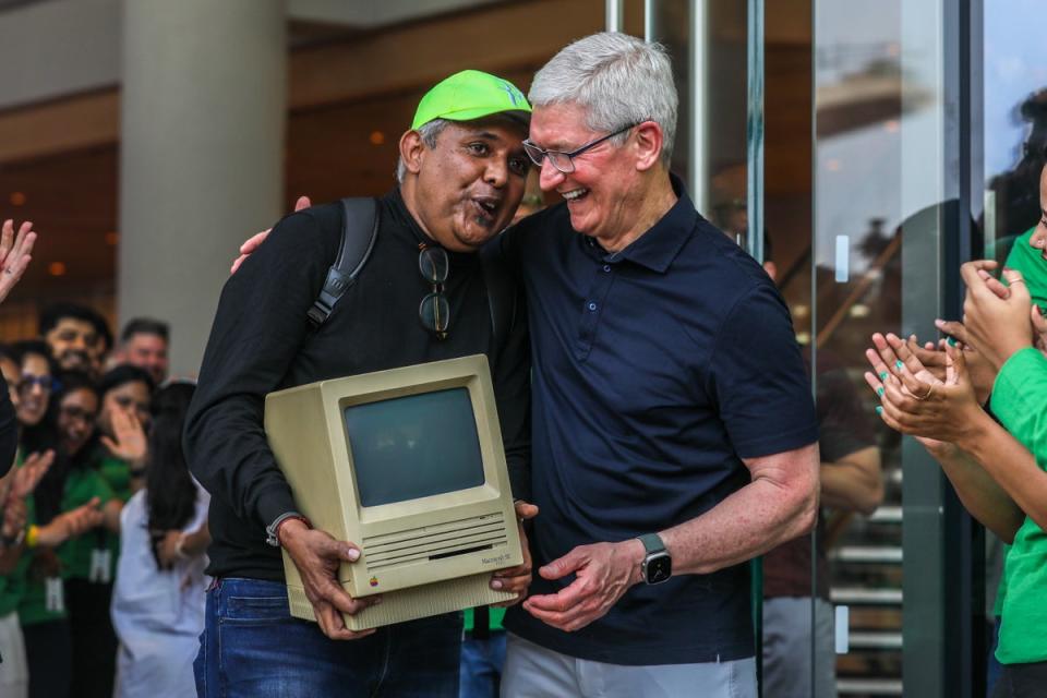 Apple’s chief executive officer Tim Cook welcomes consumers at the opening of the first Apple shop in Mumbai (EPA)