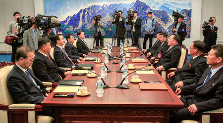 South Korean Unification Minister Cho Myoung-gyon talks with his North Korean counterpart Ri Son Gwon during their meeting at the truce village of Panmunjom, South Korea, June 1, 2018. Yonhap via REUTERS