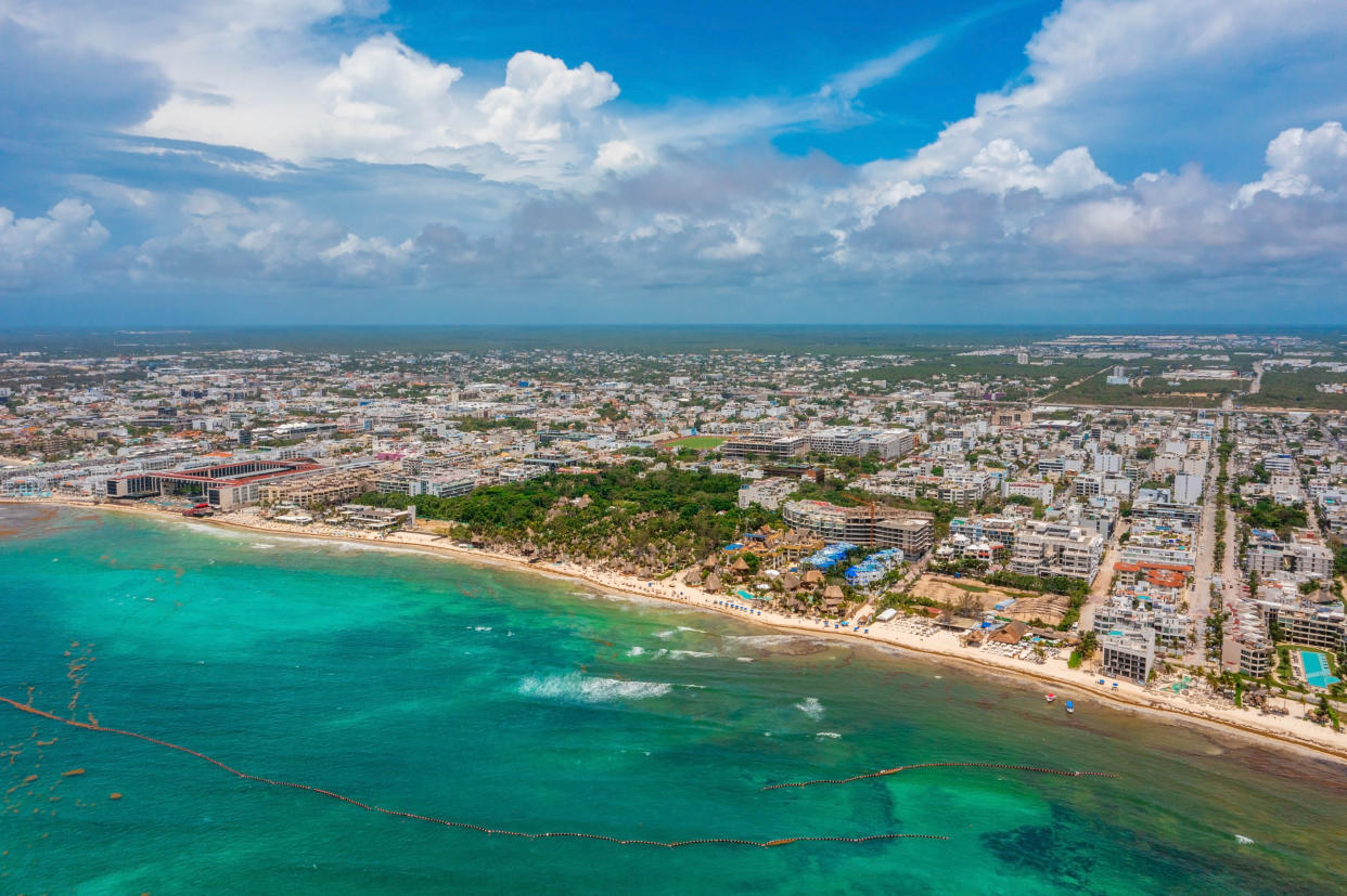 Aerial view of the Playa Del Carmen town in Mexico. View of the luxury resorts and blue turquoise Caribbean beach.