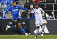 Orlando City's Ivan Angulo, right, breaks away from CF Montreal's George Campbell, left, during second-half MLS soccer match action in Montreal, Saturday, April 20, 2024. (Graham Hughes/The Canadian Press via AP)