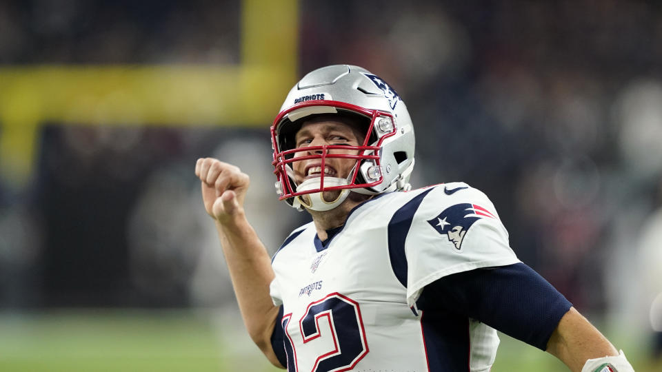 New England Patriots' Tom Brady (12) yells to the fans before an NFL football game against the Houston Texans Sunday, Dec. 1, 2019, in Houston. (AP Photo/David J. Phillip)