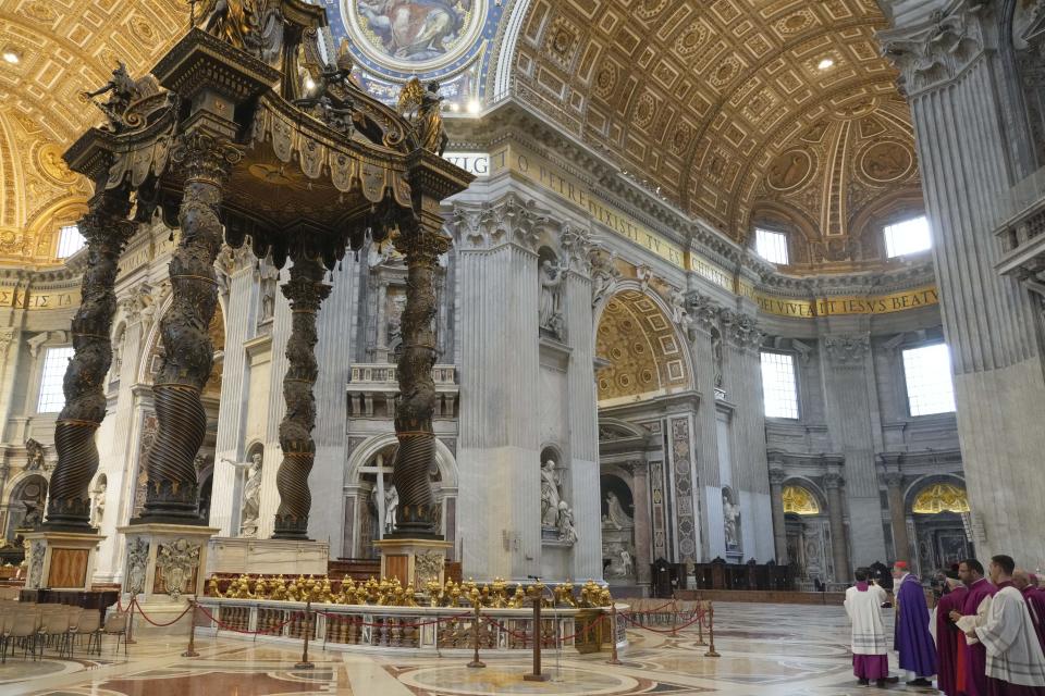 Cardinal Mauro Bassetti, right, celebrates a penitential rite in front of the altar of the confession inside St. Peter's Basilica, Saturday, June 3, 2023. (AP Photo/Gregorio Borgia)