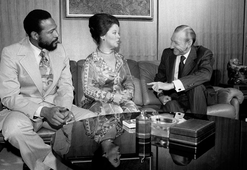 In this Monday, Oct. 13, 1975, file photo, singer-songwriter Marvin Gaye, left, sits with United Nations Secretary-General Kurt Waldheim, right, and Shirley Temple Black, U.S. Ambassador to Ghana, at the United Nations. Gaye is donating proceeds from his Sunday performance "Salute to the U.N." to UNESCO for an African literacy campaign. Temple, who died at her home near San Francisco, Monday, Feb. 10, 2014, at 85, sang, danced, sobbed and grinned her way into the hearts of Depression-era moviegoers and remains the ultimate child star decades later. (AP Photo/File)