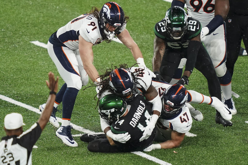 Denver Broncos' A.J. Johnson (45) and Josey Jewell (47) sack New York Jets quarterback Sam Darnold (14) during the second half of an NFL football game Thursday, Oct. 1, 2020, in East Rutherford, N.J. (AP Photo/John Minchillo)