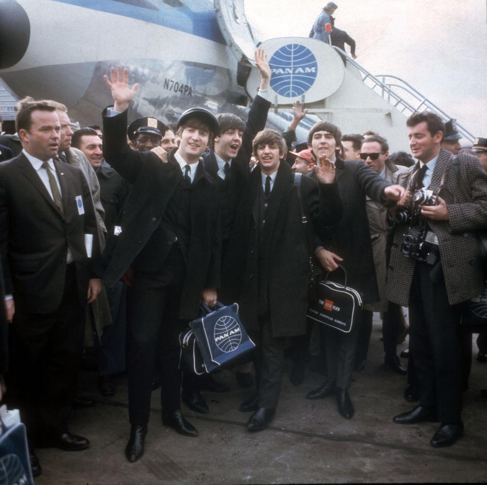 The Beatles arrive in New York on Feb. 7, 1964, for their first U.S. appearances.