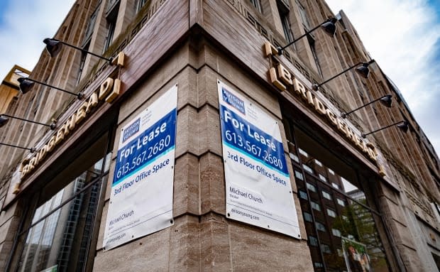 A 'For Lease' sign on a building on Bank Street in Ottawa in October 2020 advertises vacant office space. According to Altus Group, office availability in the city increased from 8.8 per cent in the last quarter of 2019 to 10 per cent in the fourth quarter of 2020.