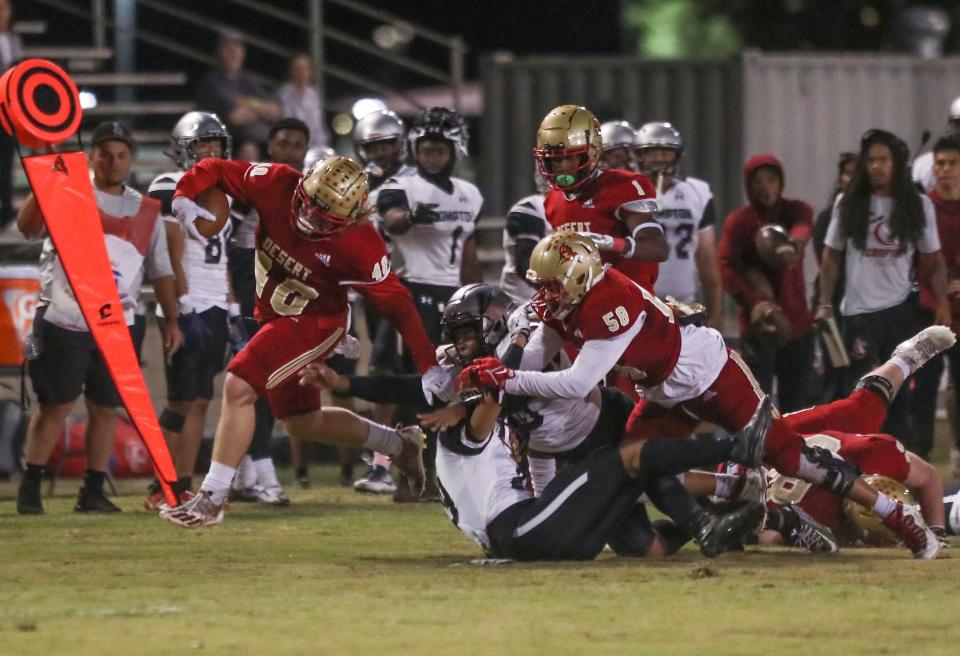 College of the Desert fullback Justin Murray picks up a first down against Compton in Palm Desert, Calif., Oct 22, 2022.