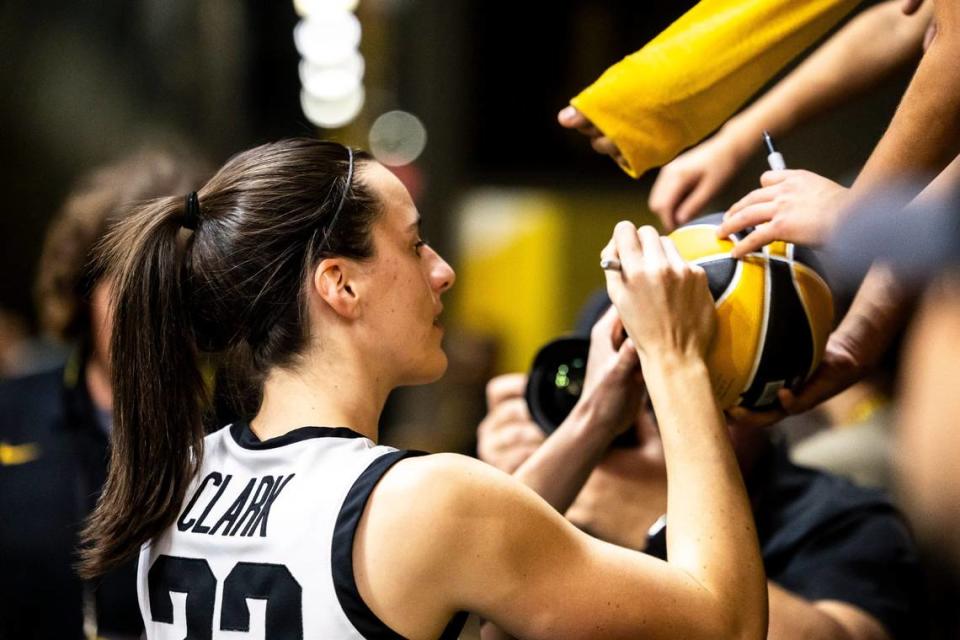 Iowa guard Caitlin Clark (22) signs autographs for fans after a NCAA college women’s basketball game against Fairleigh Dickinson University Knights, Monday, Nov. 6, 2023, at Carver-Hawkeye Arena in Iowa City, Iowa. Joseph Cress/For the Register/Joseph Cress/For the Register / USA TODAY NETWORK