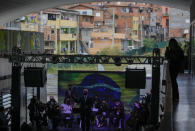 Musicians residents in the Paraisopolis favela, as part of the community's centennial celebration, in Sao Paulo, Brazil, Thursday, Sept. 16, 2021. One of the largest favela's in Brazil, home to tens of thousands of residents in the country's largest and wealthiest city, Paraisopolis is grappling with crime and a pandemic that have challenged daily life for many who live there, but organizers say its people have built a vibrant community and are launching a 10-day celebration of its achievements. (AP Photo/Andre Penner)