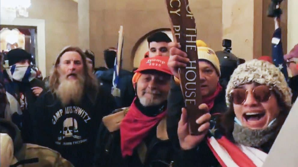 A man is seen wearing an Auschwitz sweatshirt inside the Capitol building during the Jan. 6 riot. (ITN/DOJ)