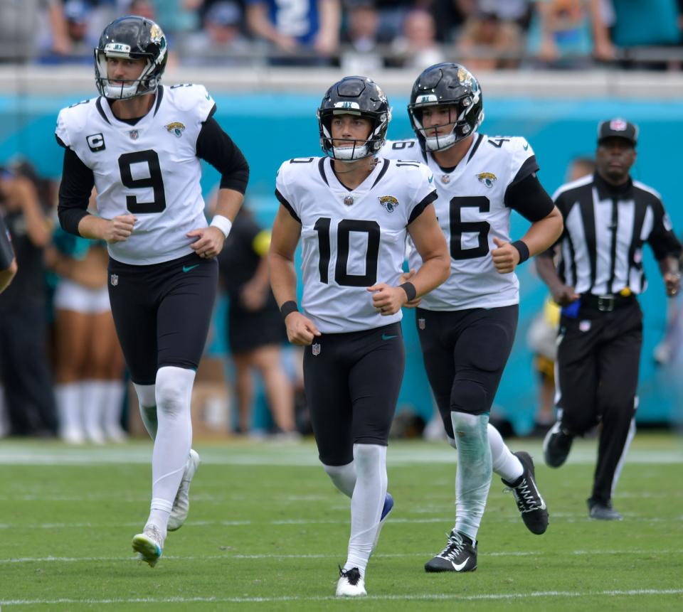 Jacksonville Jaguars punter Logan Cooke (9), place kicker Riley Patterson (10) and long snapper Ross Matiscik (46) run to the sidelines after Patterson made the extra point after the Jaguars late third quarter touchdown. The Jaguars went into the first half with a 17 to 0 lead over the Colts and went on to win the game 24 to 0. The Jacksonville Jaguars hosted the Indianapolis Colts at TIAA Bank field in Jacksonville, FL Sunday, September 18, 2022. [Bob Self/Florida Times-Union]