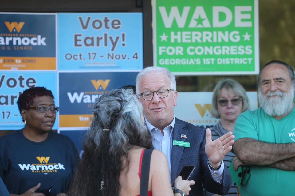 US House candidate Wade Herring talks with supporters during a campaign event on October 25, 2022.