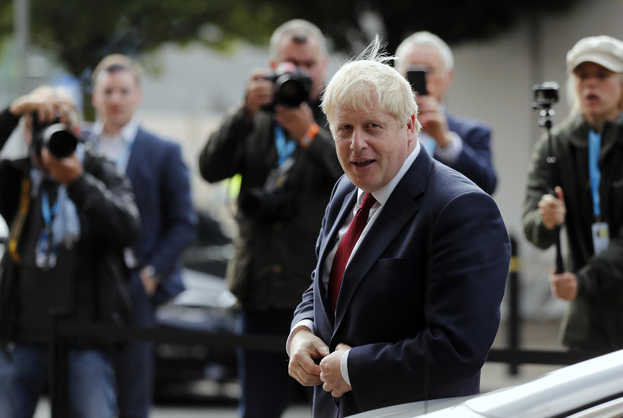 Britain's Prime Minister Boris Johnson arrives at the Conservative Party Conference in Manchester, England, Monday, Sept. 30, 2019. Johnson's office denied a journalist's claim that Johnson grabbed her thigh at a private lunch two decades ago. Sunday Times columnist Charlotte Edwardes says the incident took place when she worked at The Spectator, a conservative newsmagazine, while Johnson was its editor. (AP Photo/Frank Augstein)