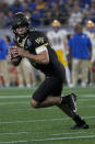 Wake Forest quarterback Sam Hartman looks to pass against Pittsburgh during the first half of the Atlantic Coast Conference championship NCAA college football game Saturday, Dec. 4, 2021, in Charlotte, N.C. (AP Photo/Chris Carlson)