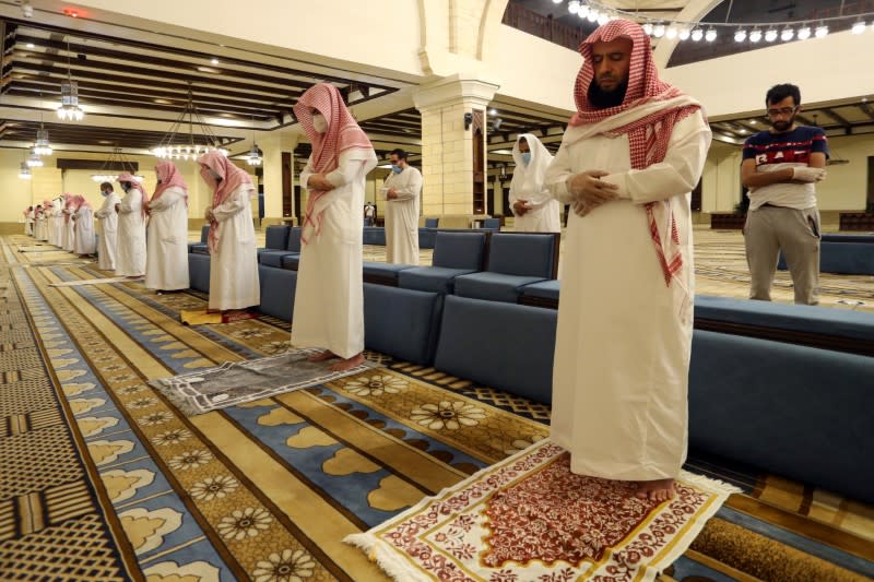 Muslims perform the Al-Fajr prayer inside the Al-Rajhi Mosque while practicing social distancing, after the announcement of the easing of lockdown measures amid the coronavirus disease (COVID-19) outbreak, in Riyadh