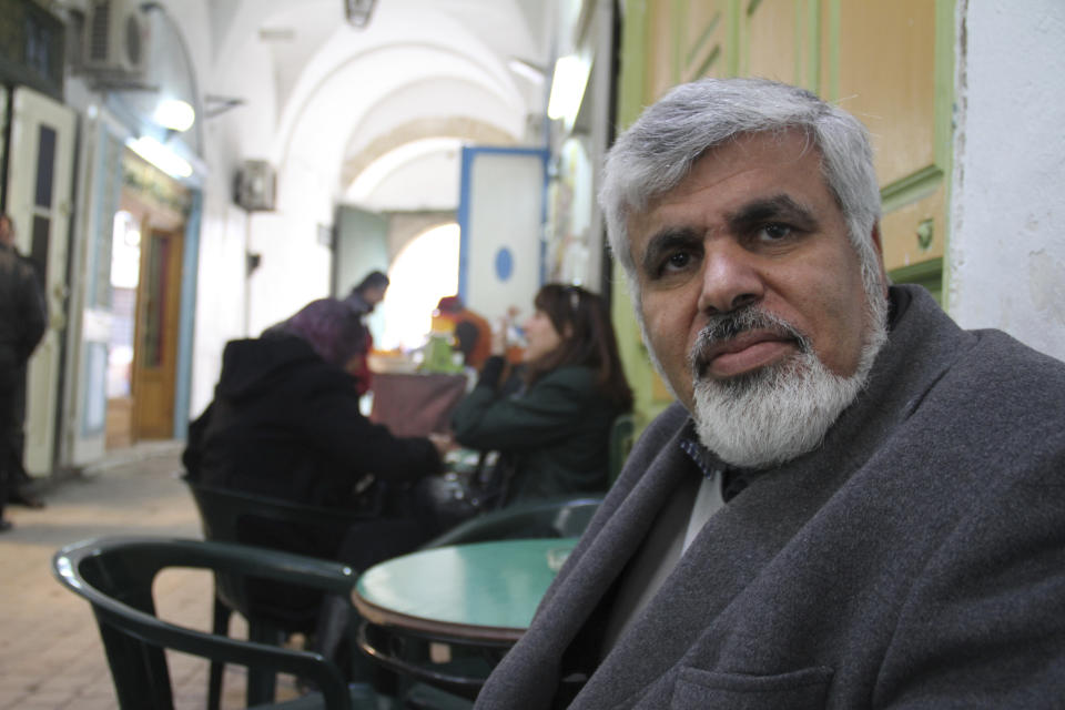 FILE - Said Ferjani, a high ranking member of the moderate Islamist Ennahda Party, sits in Tunis' old city discussing the clash between hardline secularists and Islamists, on Saturday Feb. 25, 2012. Family members of jailed lawyers and politicians, including Ferjani, in Tunisia want the International Criminal Court to investigate claims of political persecution and human rights violations as an increasing number of President Kais Saied's opponents are arrested and several in prison stage hunger strikes. Jailed dissidents' sons and daughters in The Hague, Netherlands, on Thursday, Oct. 5, 2023, will announce plans to pursue action at the court. (AP Photo/ Paul Schemm, File)