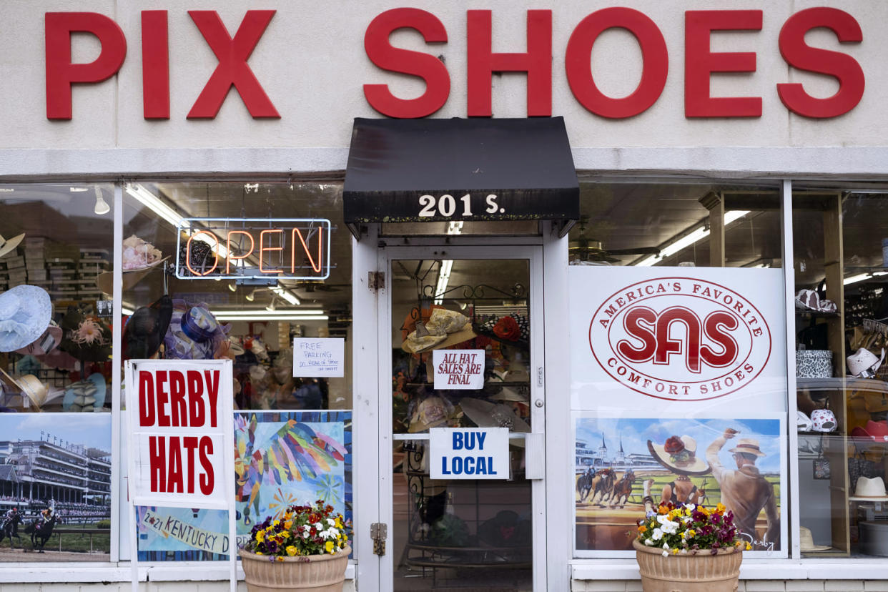 The exterior of Pix Shoes in Louisville with signs advertising Derby Hats. (Lili Kobielski for NBC News)