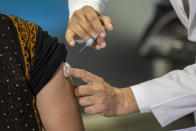 A health worker performs a trial run of the COVID-19 vaccine delivery system in New Delhi, India, Friday, Jan. 8, 2021. India will kick off the coronavirus vaccination drive on Jan. 16 to stem the pandemic in the world’s second-most populous country. A Health Ministry statement says that priority will be given to the healthcare workers and the frontline workers, estimated around 30 million. (AP Photo/Altaf Qadri)