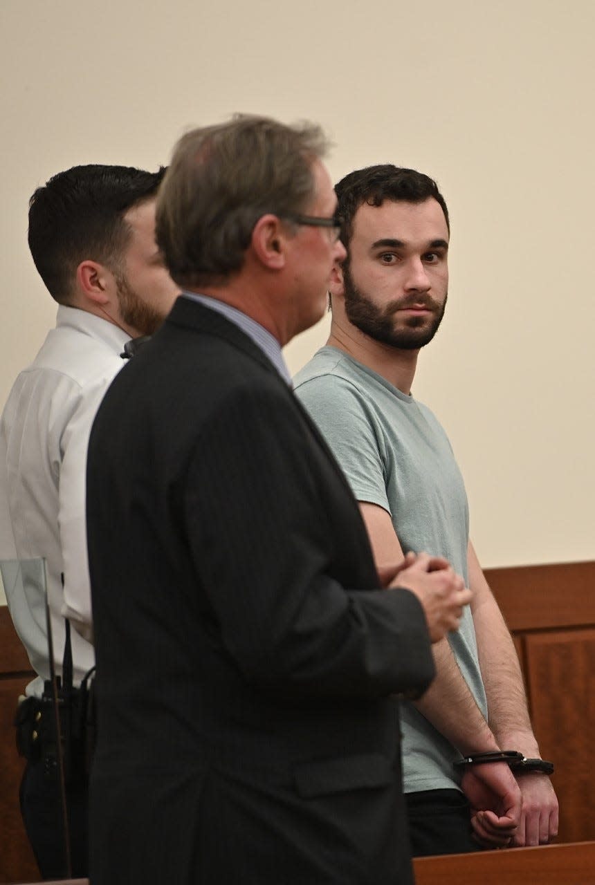 Samuel Peckham, right, in Central District Court on Wednesday. In foreground in his lawyer, Michael Hussey.