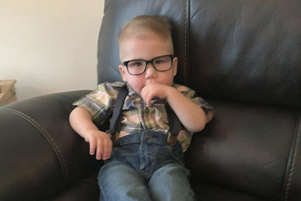 This photo provided by Reeanne Parisien shows her son, Greyson, relaxing at home in Belcourt, N.D., in August 2019. Greyson's journey to correct a heart defect led the Turtle Mountain Band of Chippewa Indians to designate a spot on tribal IDs for organ donation. (Reeanne Parisien via AP)