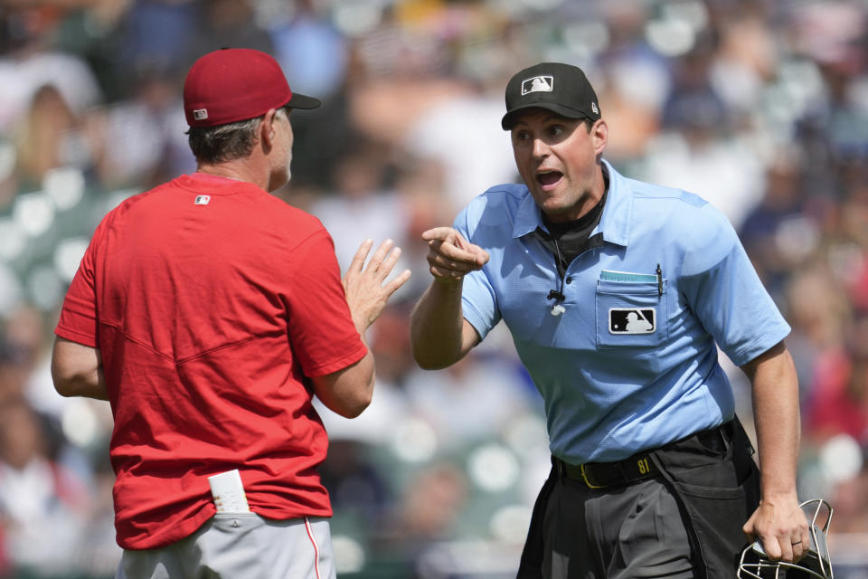 Home plate umpire Quinn Wolcott argues with Cincinnati Reds manager David Bell in the fourth inning of a baseball game, Thursday, Sept. 14, 2023, in Detroit. (AP Photo/Paul Sancya)