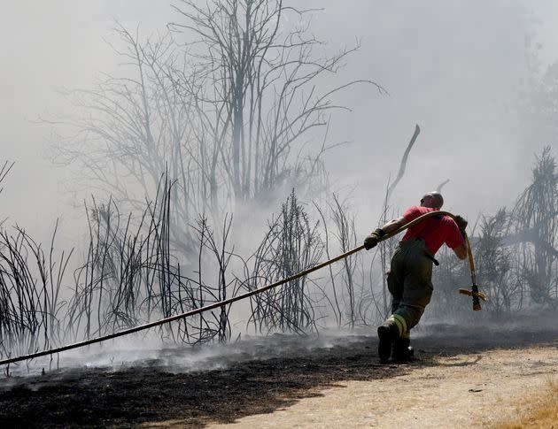 Firefighters battle a grass fire on Leyton flats in east London. (Photo: Yui Mok via PA Wire/PA Images)