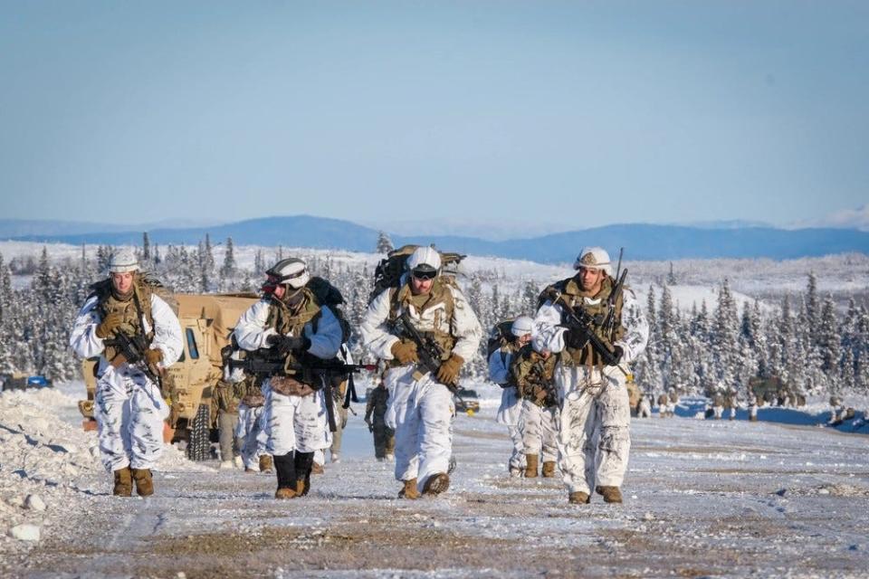 U.S. Army paratroopers from 3rd Battalion, 509th Parachute Infantry Regiment, 2nd Infantry Brigade Combat Team (Airborne), 11th Airborne Division, leave the drop zone after finishing an airborne operation as part of Joint Pacific Multinational Readiness Center 24-02 in Donnelly Training Area, Alaska, Feb. 8, 2024.