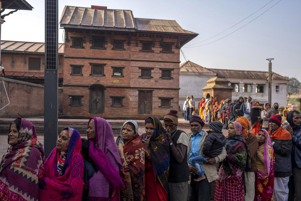 Indian pilgrims line up, forming a queue as they wait to enter Pashupatinath temple in Kathmandu, Nepal, Jan. 9, 2024. The centuries-old temple is one of the most important pilgrimage sites in Asia for Hindus. Nepal and India are the world’s two Hindu-majority nations and share a strong religious affinity. Every year, millions of Nepalese and Indians visit Hindu shrines in both countries to pray for success and the well-being of their loved ones. (AP Photo/Niranjan Shrestha)