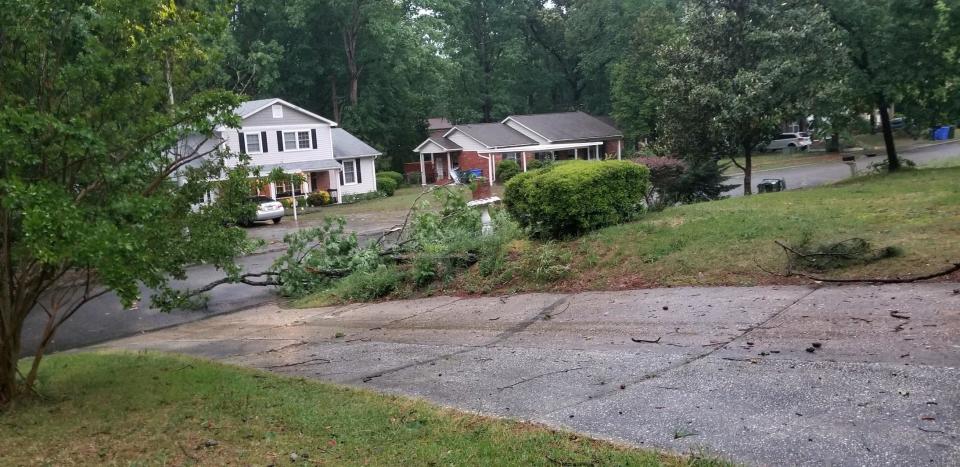 Tree limbs fell on yards in the Foxfire neighborhood in Fayetteville after storms moved through Friday, May 6, 2022.