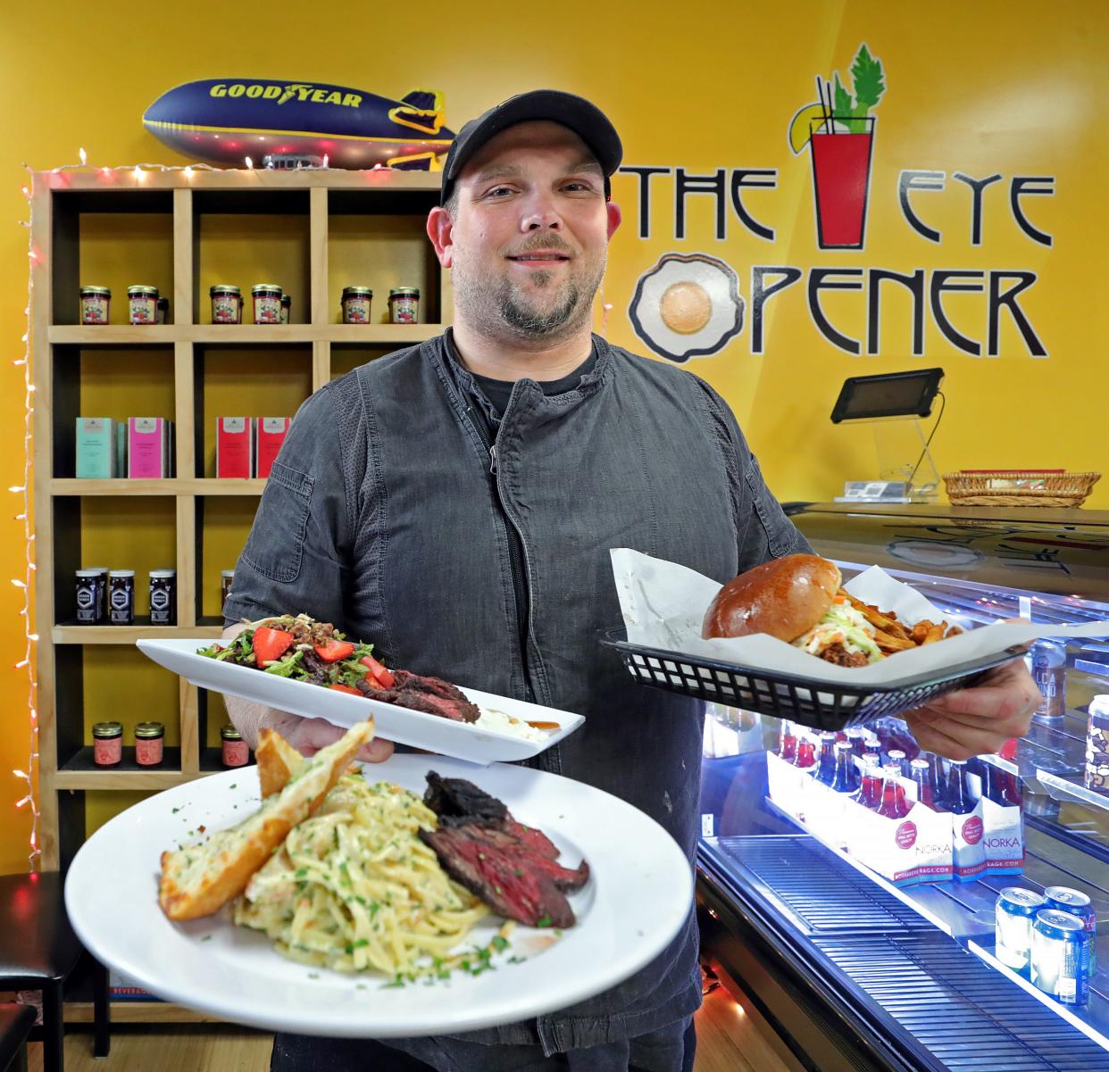The Eye Opener chef John Kilmer shows off some dinner options at the restaurant Wednesday, April 24, 2024, in Akron, Ohio.