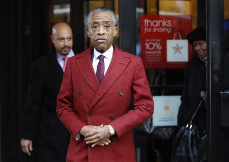 Rev. Al Sharpton leaves Macy's department store, after meeting with company officials in New York, November 4, 2013. REUTERS/Adam Hunger