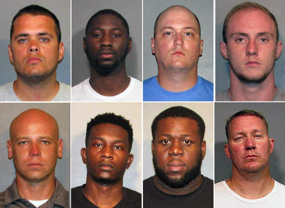 These photos provided by the Caddo Parish Sheriff's Office show, top row from left, police officers Aaron Jaudon, D'Andre Jackson, Mark Ordoyne and William Isenhour. Bottom row from left, Christopher McConnell, Brandon Walker, Treveion Brooks and David Francis. / Credit: Caddo Sheriff's Office via AP