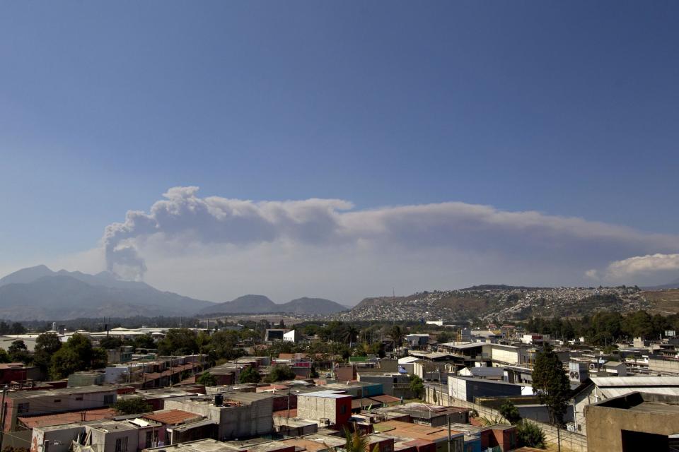 A column of ash rises from the Pacaya volcano as seen from Villa Nueva, Guatemala, Sunday, March 2, 2014. Guatemala authorities say the Pacaya volcano near Guatemala City has shot plumes of ash and vapor 2.3 miles (3.7 kilometers) high, while spewing glowing-hot rock. The eruption early Sunday is the latest round of activity at the scenic volcano located just 30 miles (50 kms) south of Guatemala City. (AP Photo/Moises Castillo)