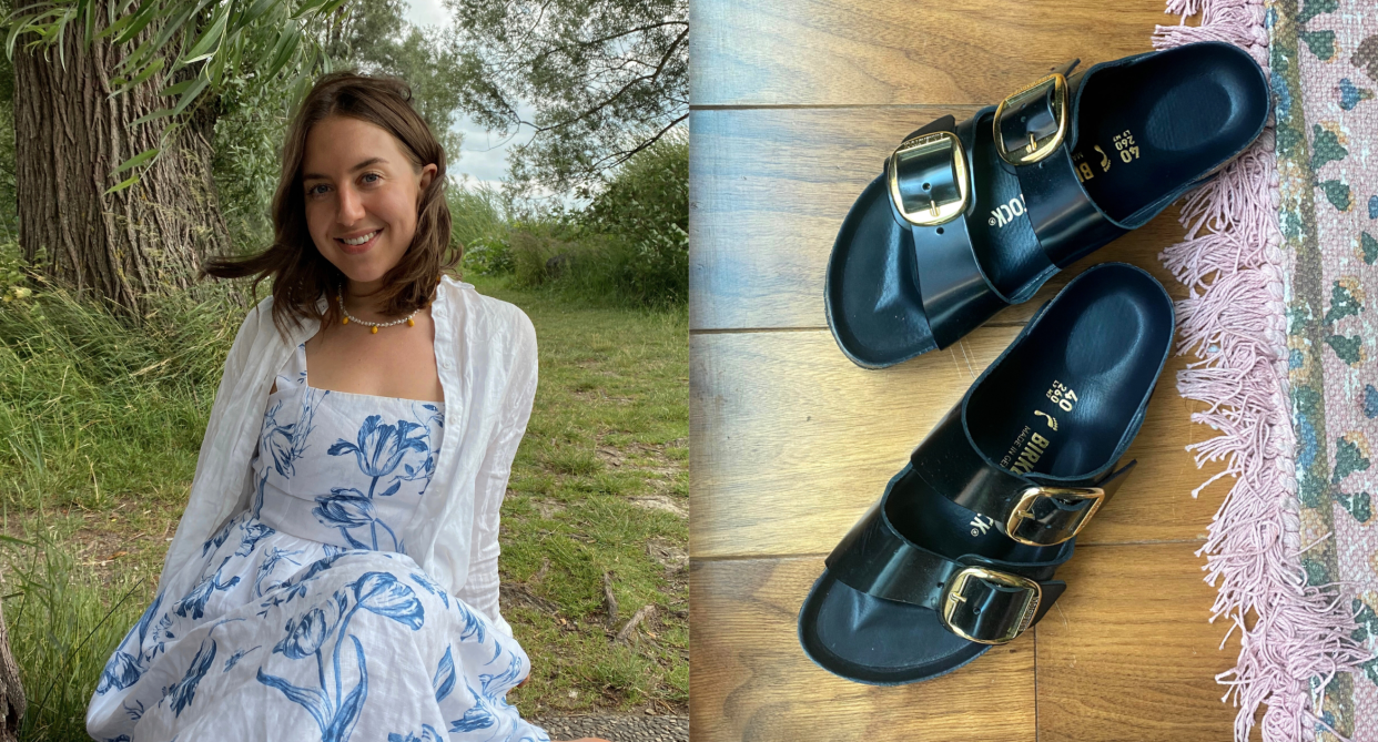 woman with brown hair sitting in white and blue reformation linen dress and white linen button-down, black birkenstock sandals 