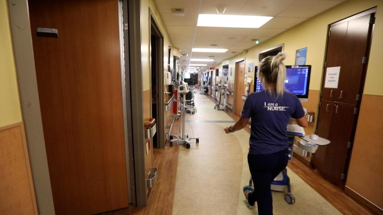  A nurse makes her way down the hall at Unity Hospital on May 31, 2023.