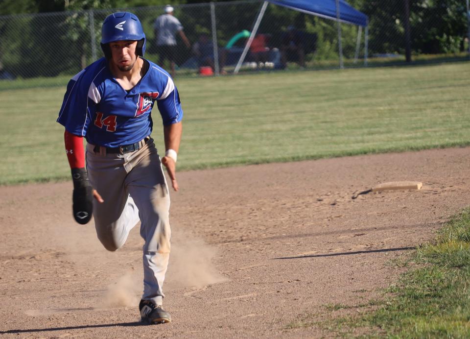 Cambridge Post 84's Blade Barclay digs for third base during a 14-9 American Legion win over Marietta at Don Coss Stadium earlier this season. Barclay will be a key contributor for Post 84 as they look to defend their title from last year during this weekend's 30th Annual Don Coss Tournament.