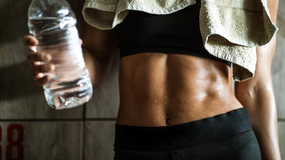 a photo of a woman with strong abs