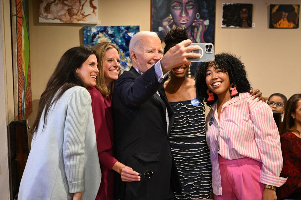 President Joe Biden poses for a selfie in Charleston, S.C., on Jan. 8, 2024.