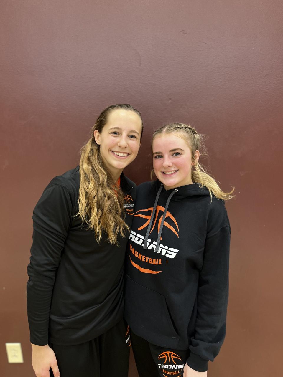 Elmwood senior Mae Herman, left, poses with junior teammate Tinley Lemmerman following a 34-32 girls basketball win over Midland at the 12th Annual Lee Westerman Girls Princeville HOliday Tournament on Wednesday, Dec. 27, 2023.